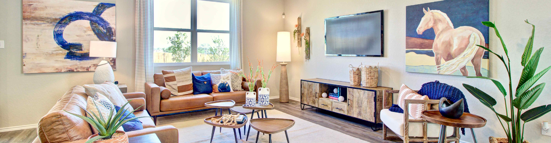 A living room with a tv and furniture.