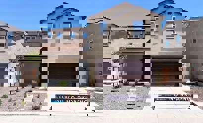 A building with a sign in front.