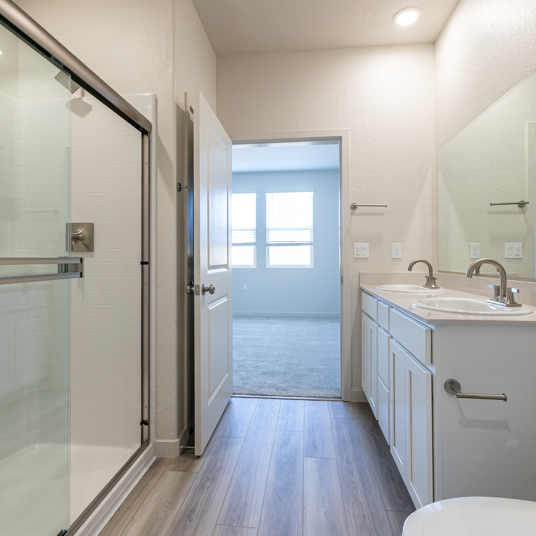 A bathroom with a glass shower.