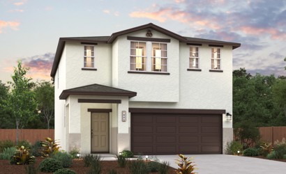 A house with a garage and trees.