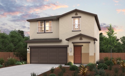 A house with a garage and trees in the back.