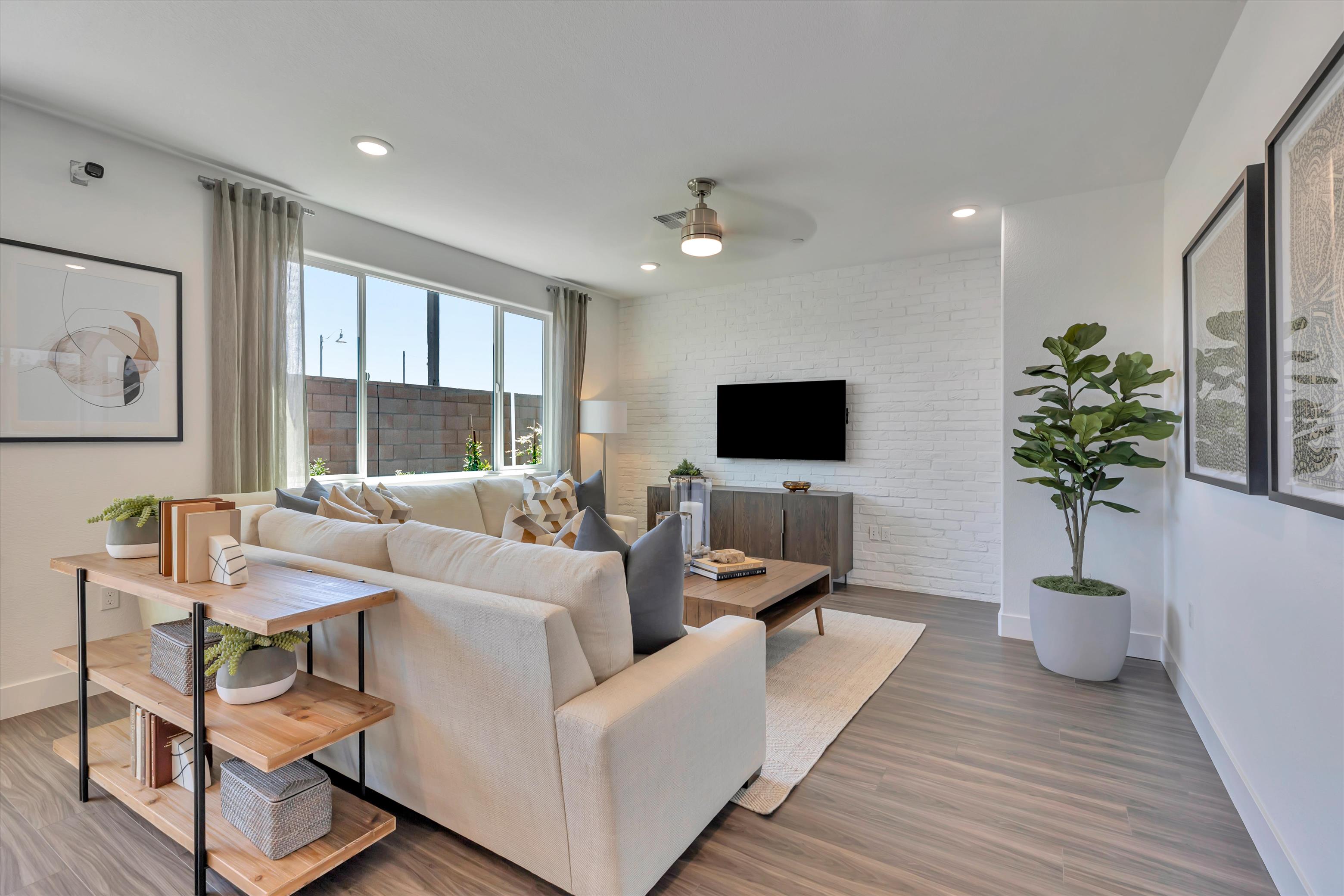 A living room with a tv and couches.
