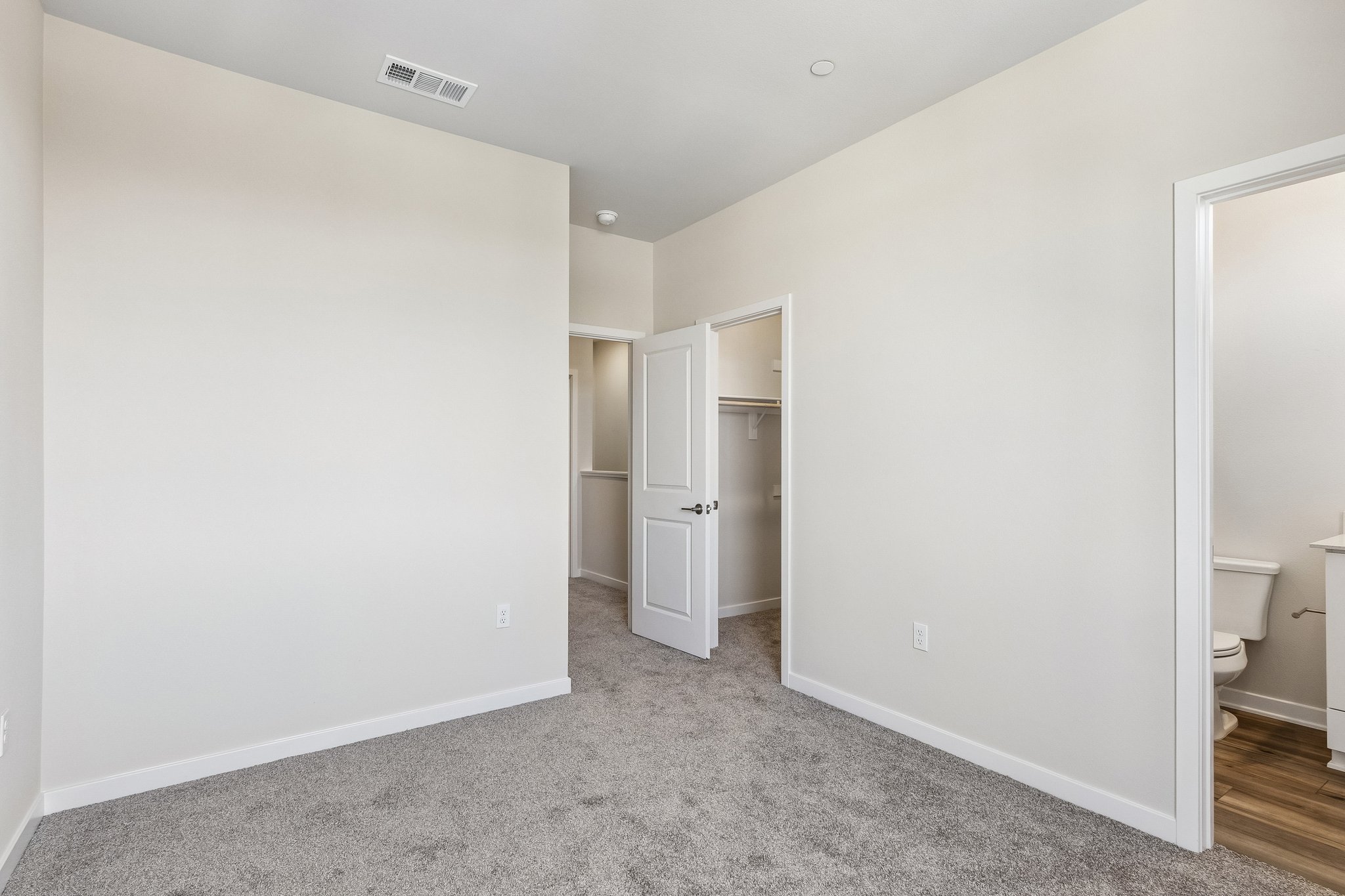 A bathroom with white walls.