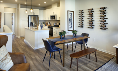 A kitchen with a dining table.