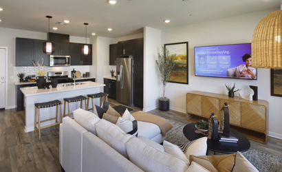 A living room with a couch and a tv.