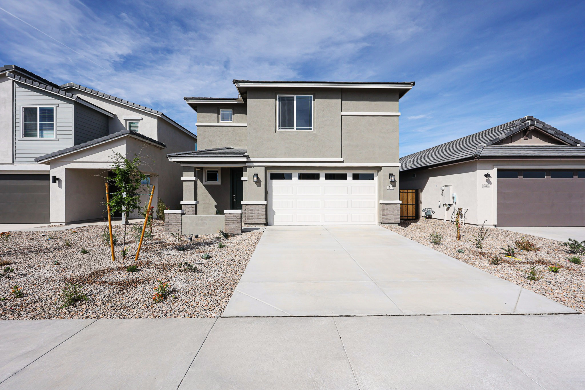 A driveway leading to a house.