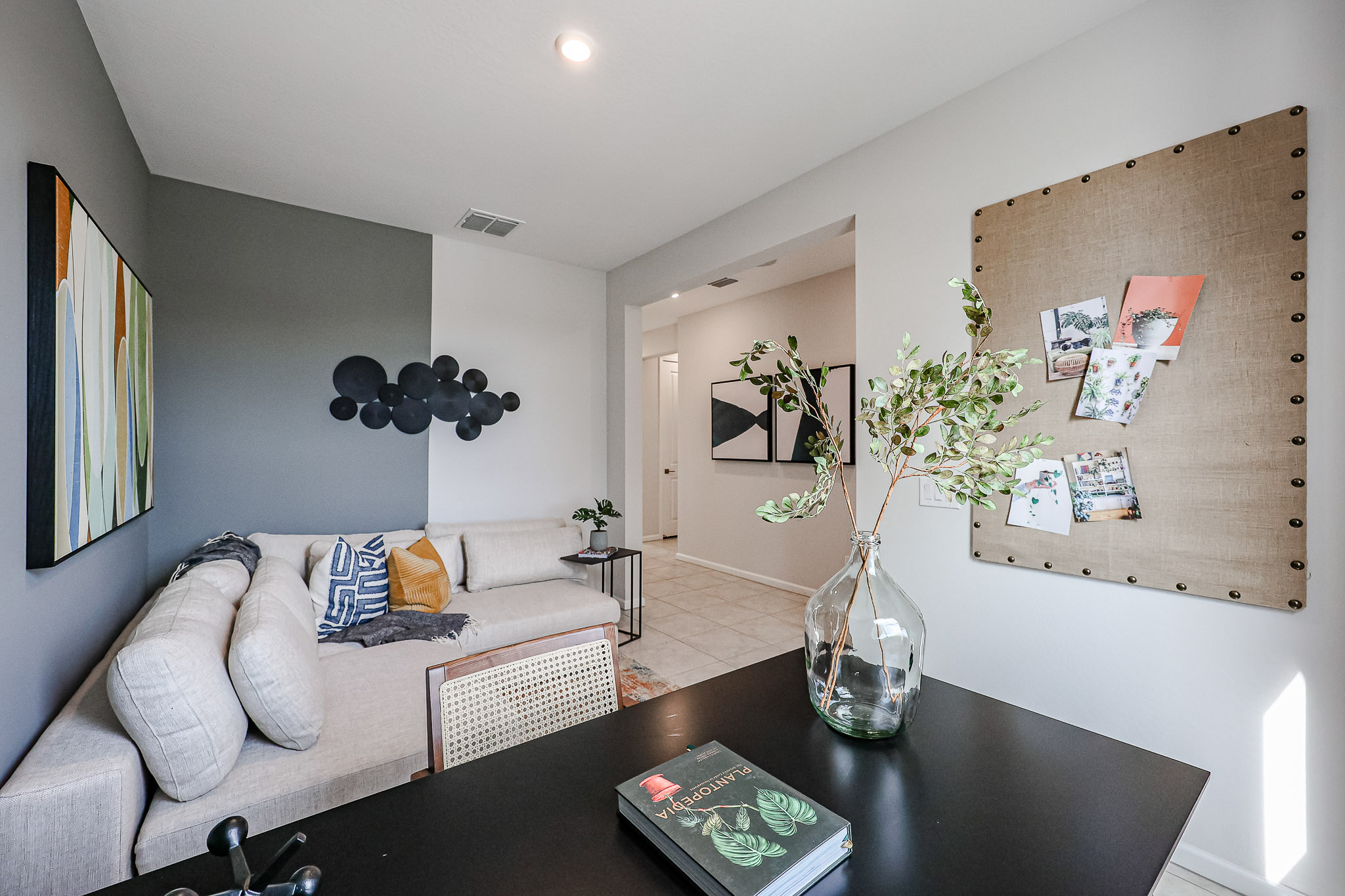 A living room with a couch and a table.