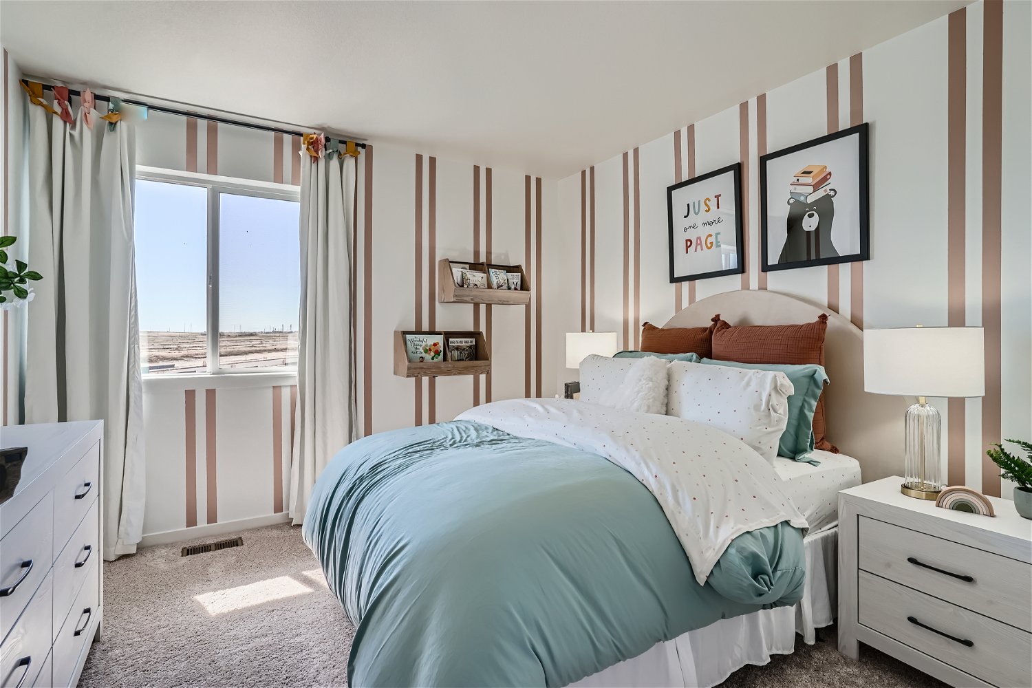 A bedroom with a bed and a window.