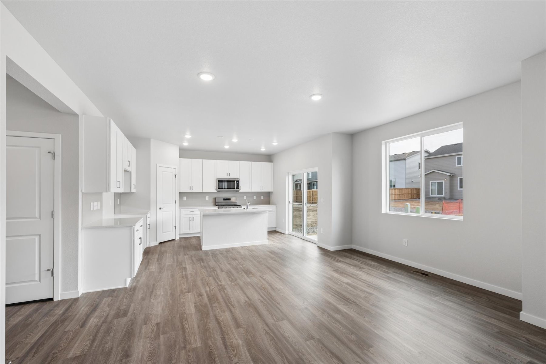 A large kitchen with white cabinets.