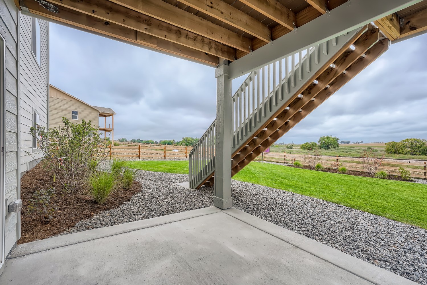 A concrete walkway with a roof.