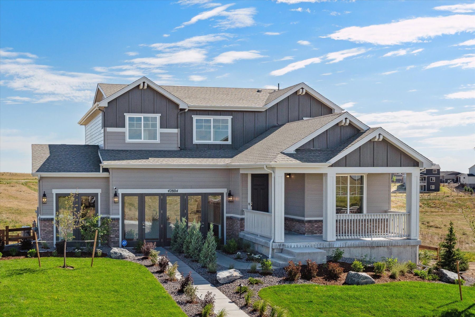 A house with a large front yard.