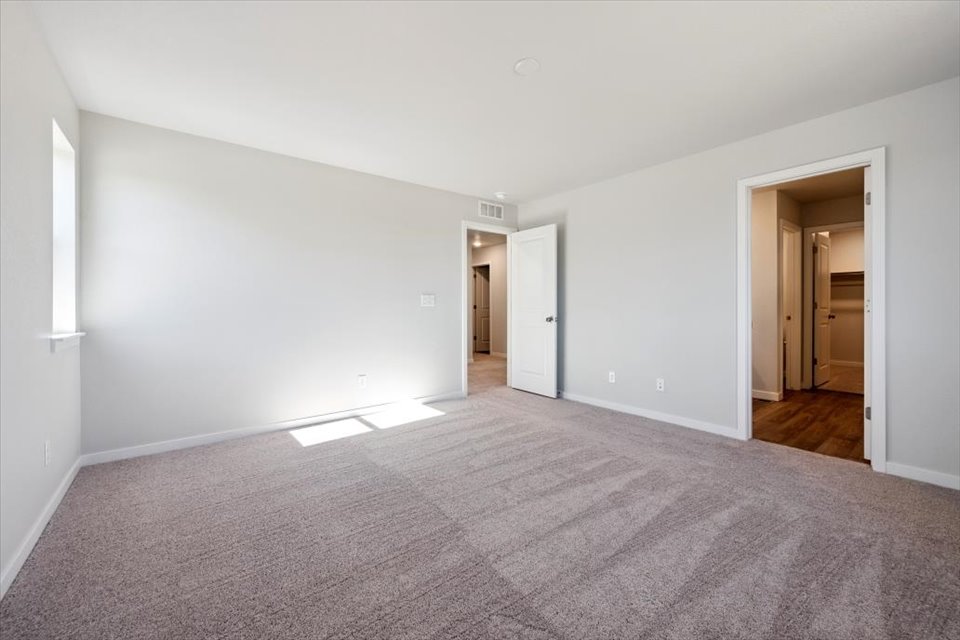 A hallway with white walls.