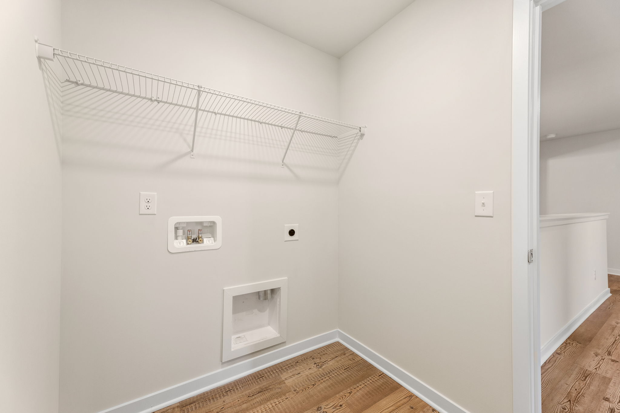 A white room with a vent.