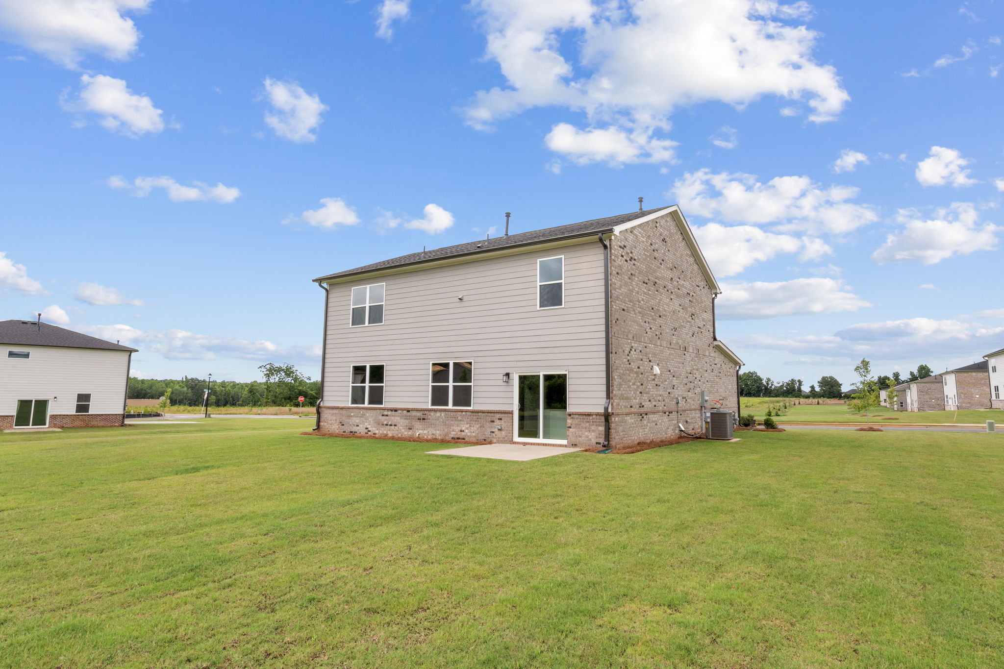 A house in a grassy field.