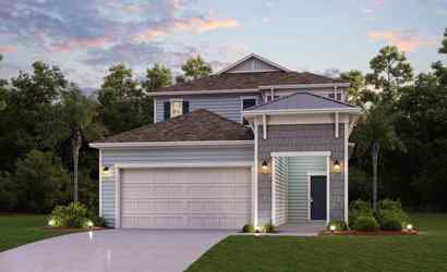 A house with a garage and trees.
