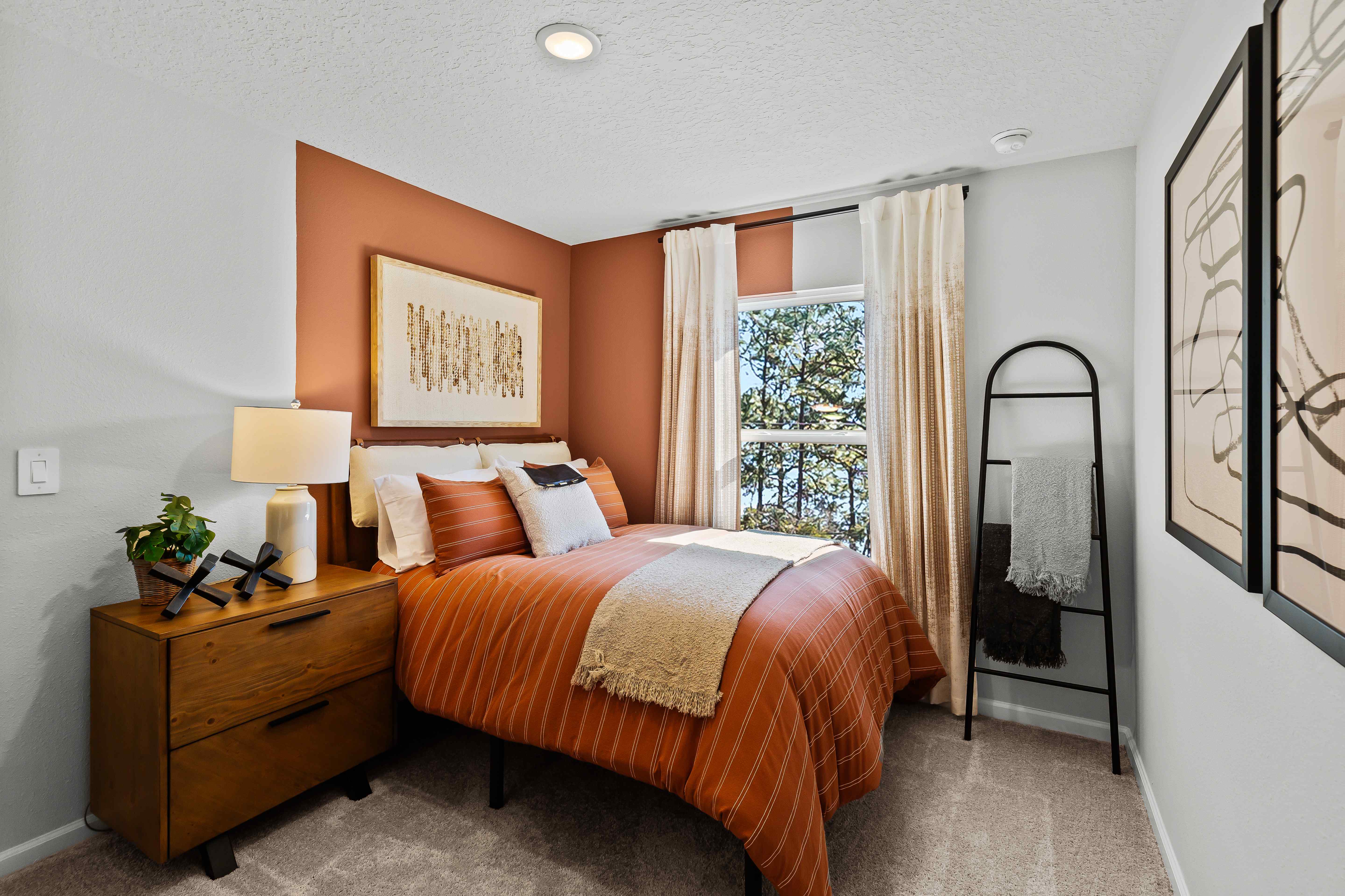 Davor Model Paired Home Guest Room with White Bed and 1 Window at The Landings at Pecan Parkchen with Marbled Counters and White Cabinets at The Landings at Pecan Park