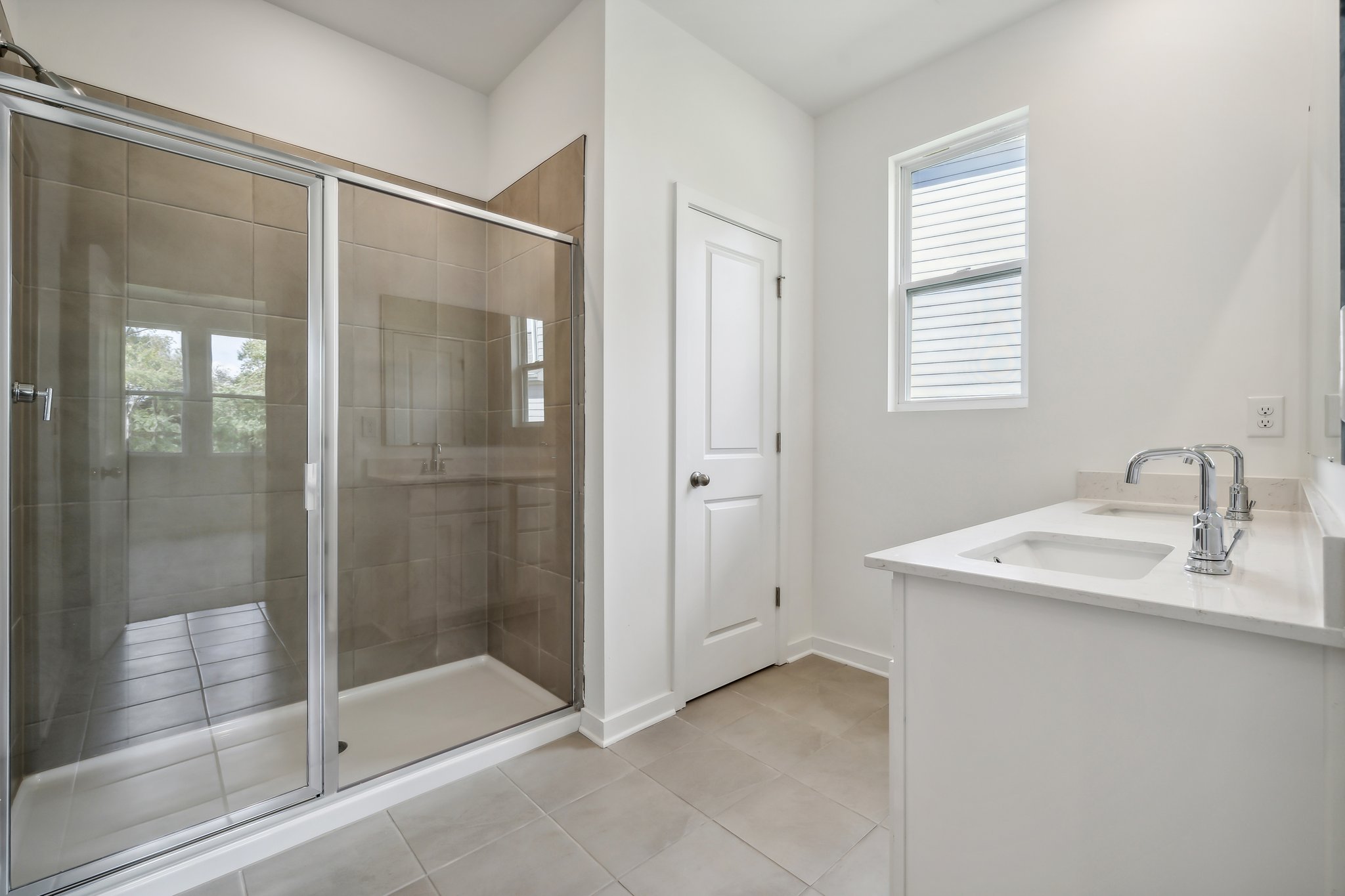 A bathroom with a glass shower.
