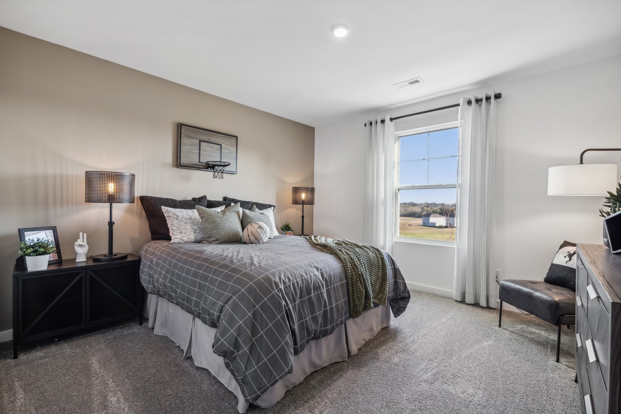 A bedroom with a large bed.