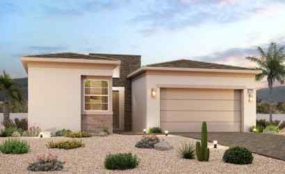 A house with a garage and a gravel driveway.