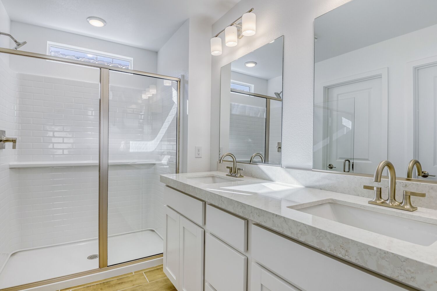 A bathroom with a glass shower.