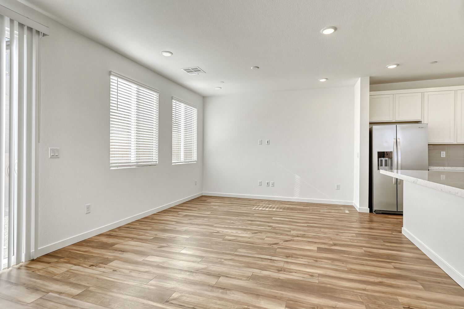 A kitchen with white walls.