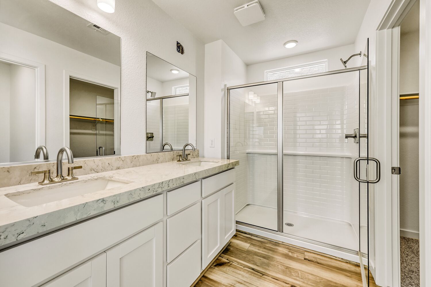 A bathroom with a glass shower.