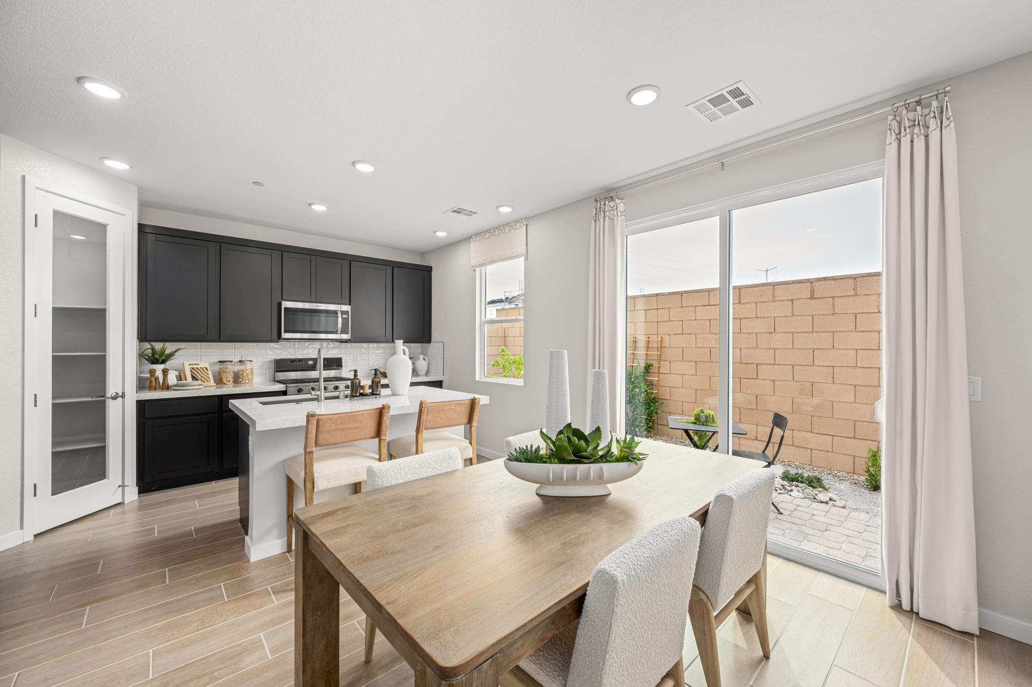 A kitchen with a dining table.