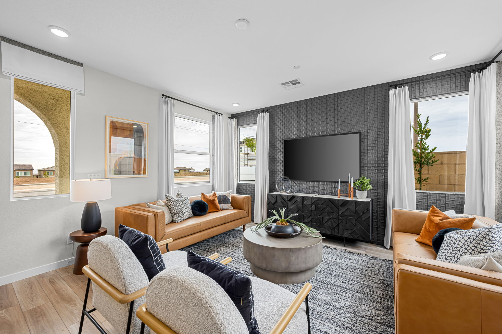A living room with a tv and couches.