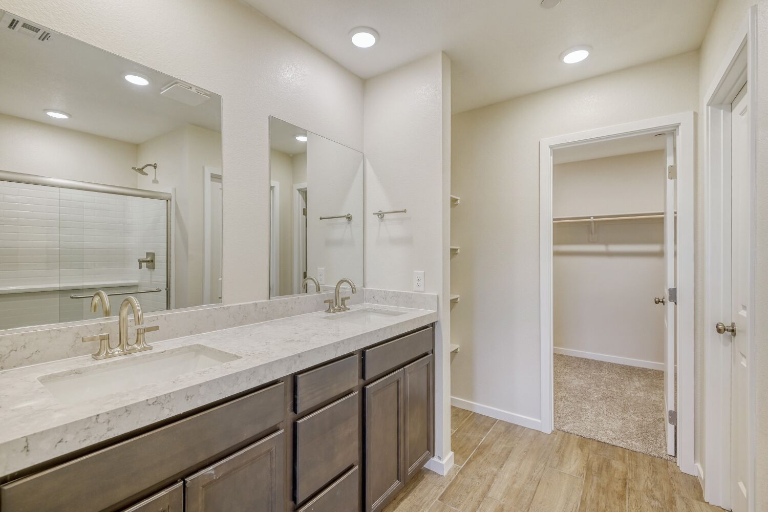 A bathroom with a large mirror.