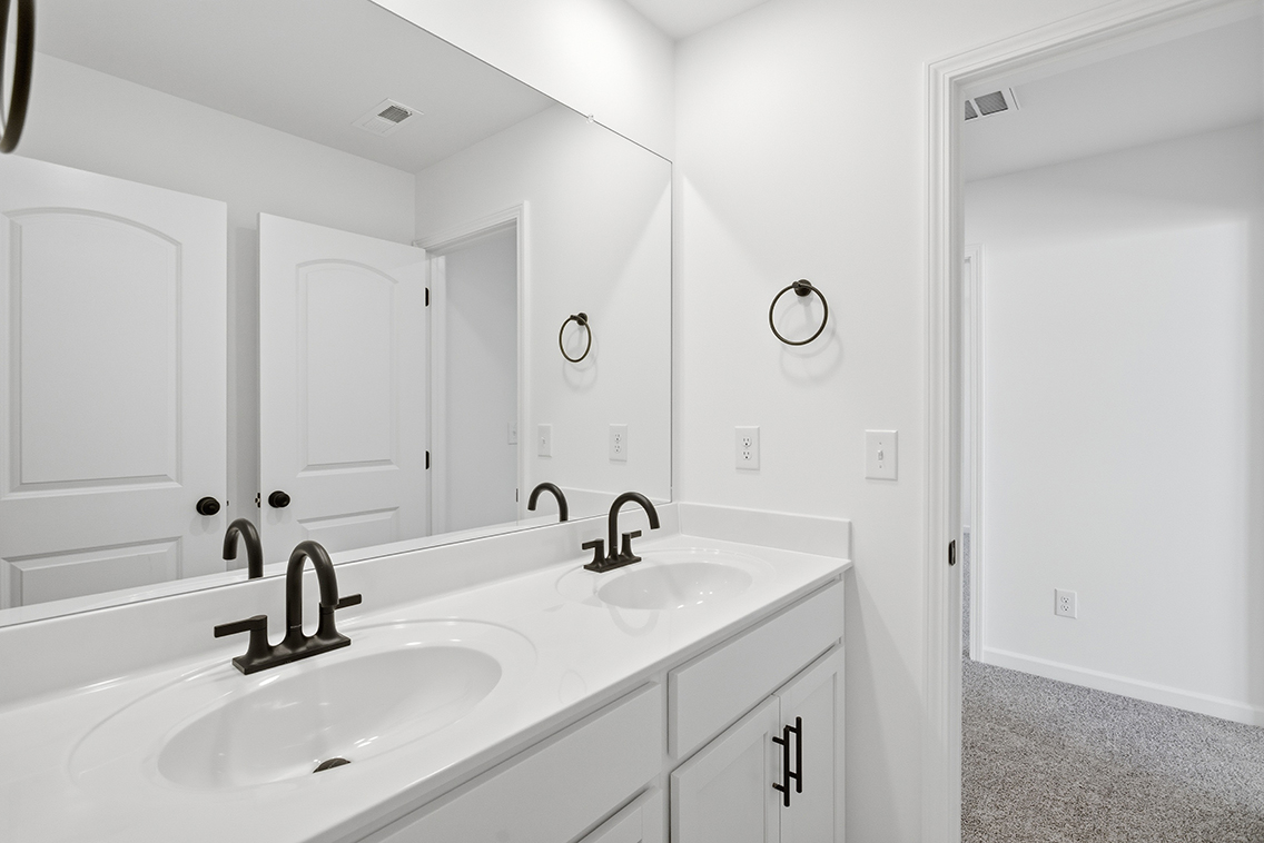 A bathroom with two sinks.