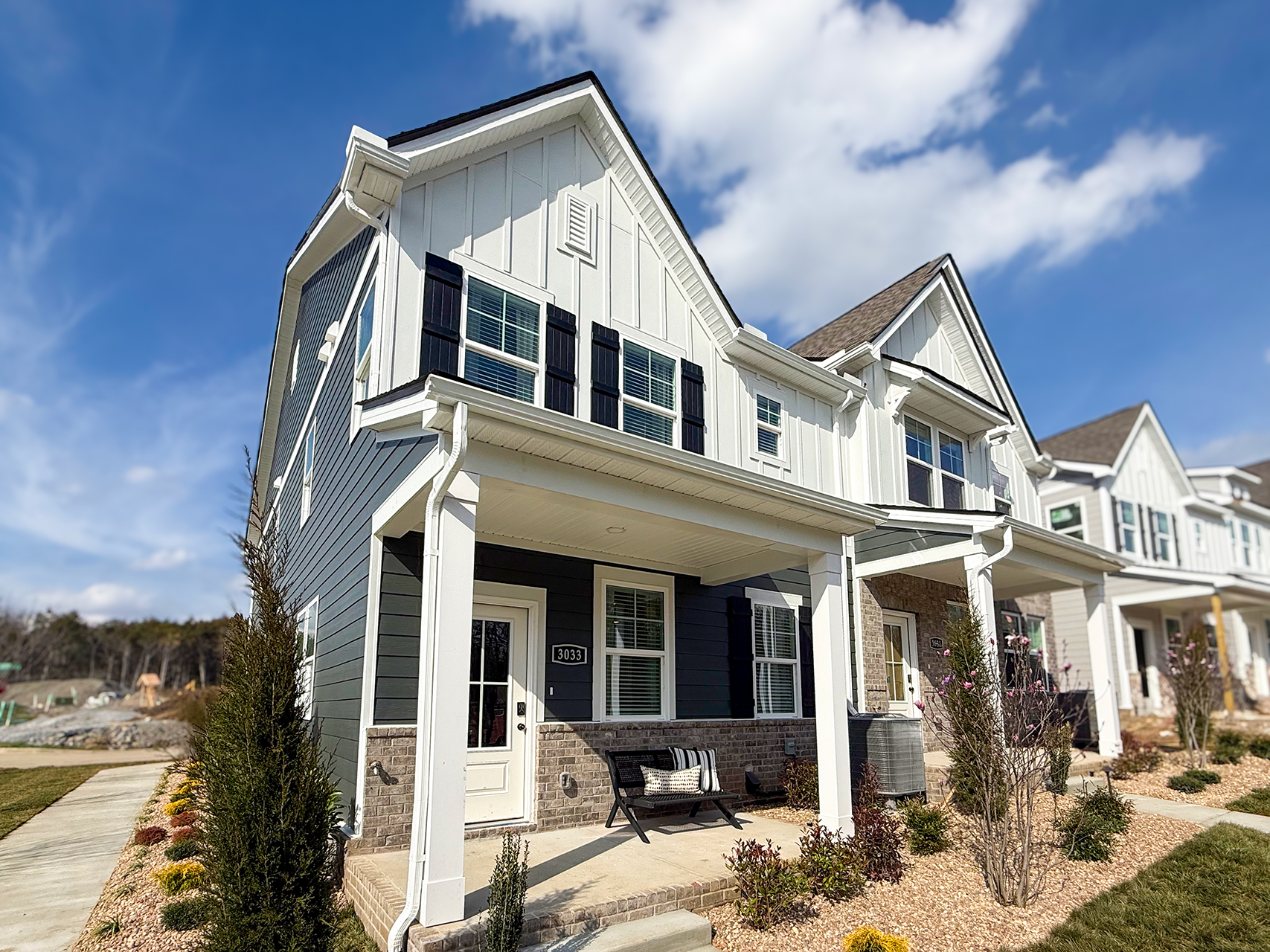 A white house with a blue sky.