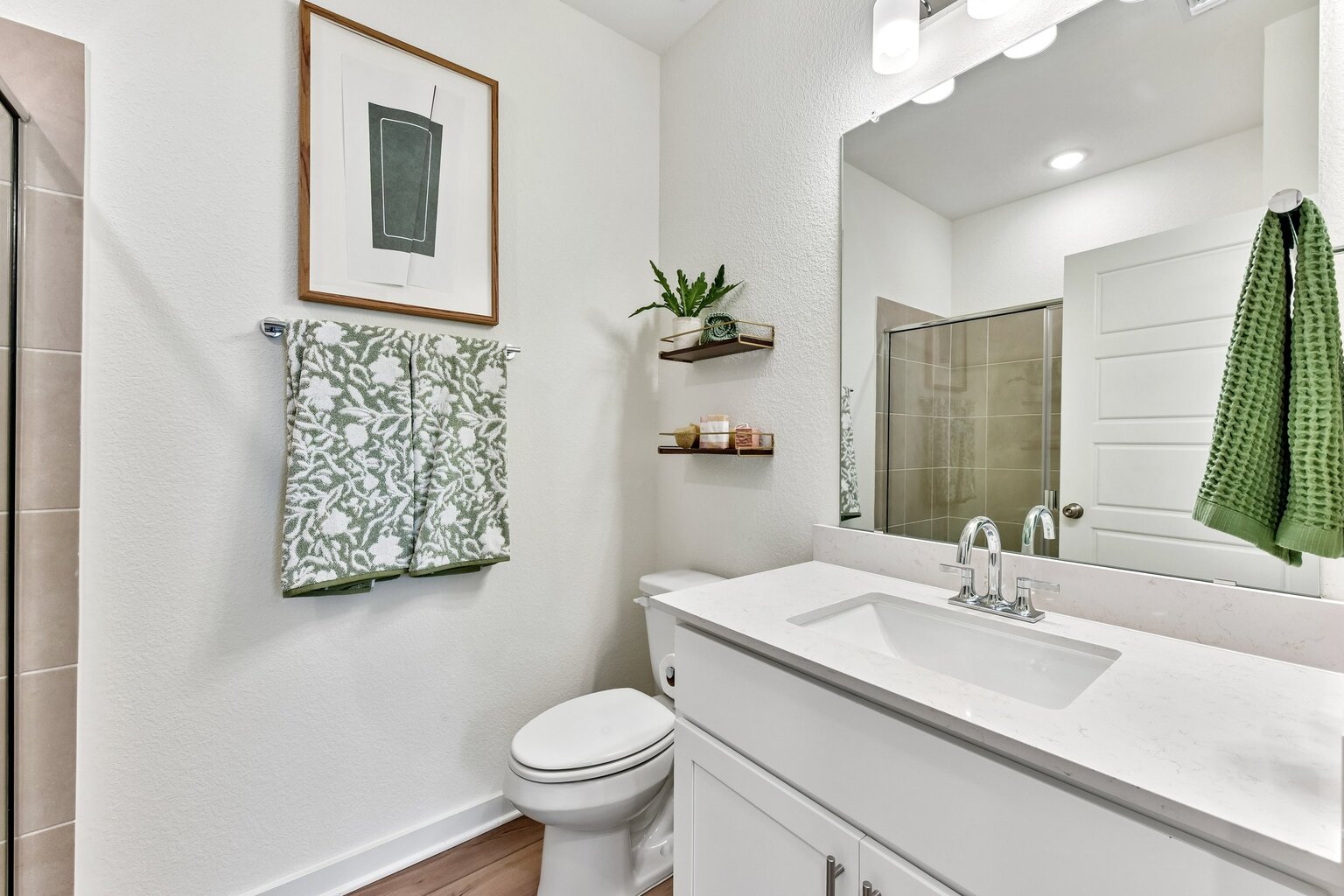 A bathroom with a sink and a toilet.