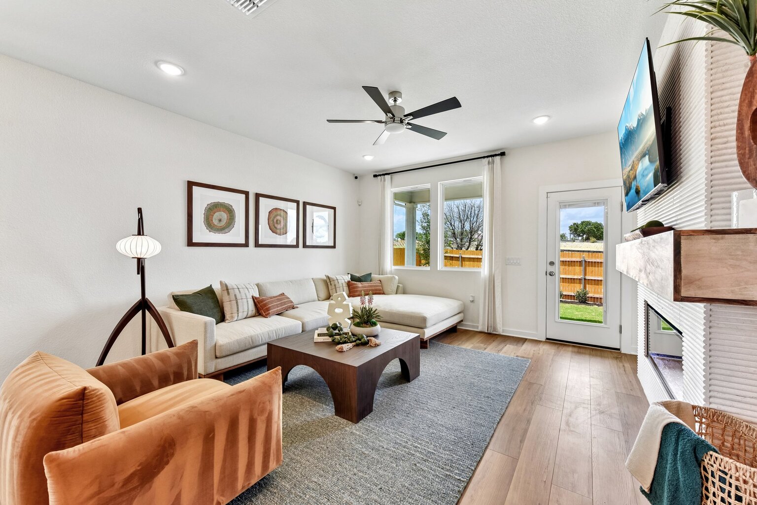 A living room with a couch and a table.