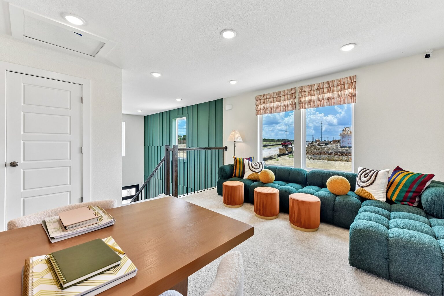 A living room with a table and chairs.