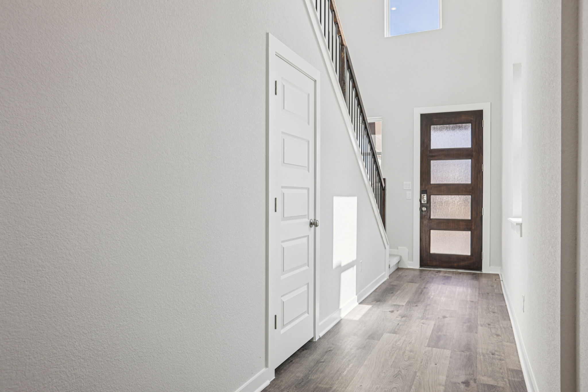 A hallway with white doors.