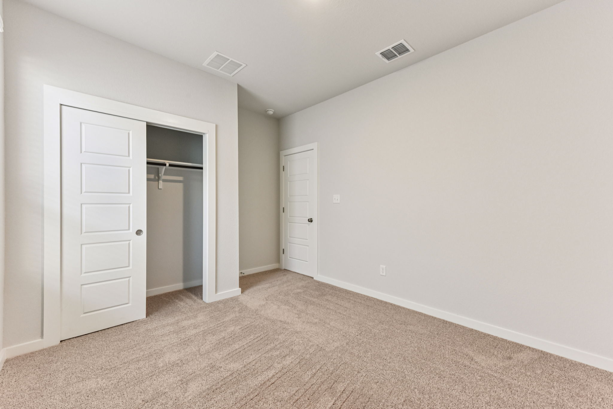 A room with white doors.