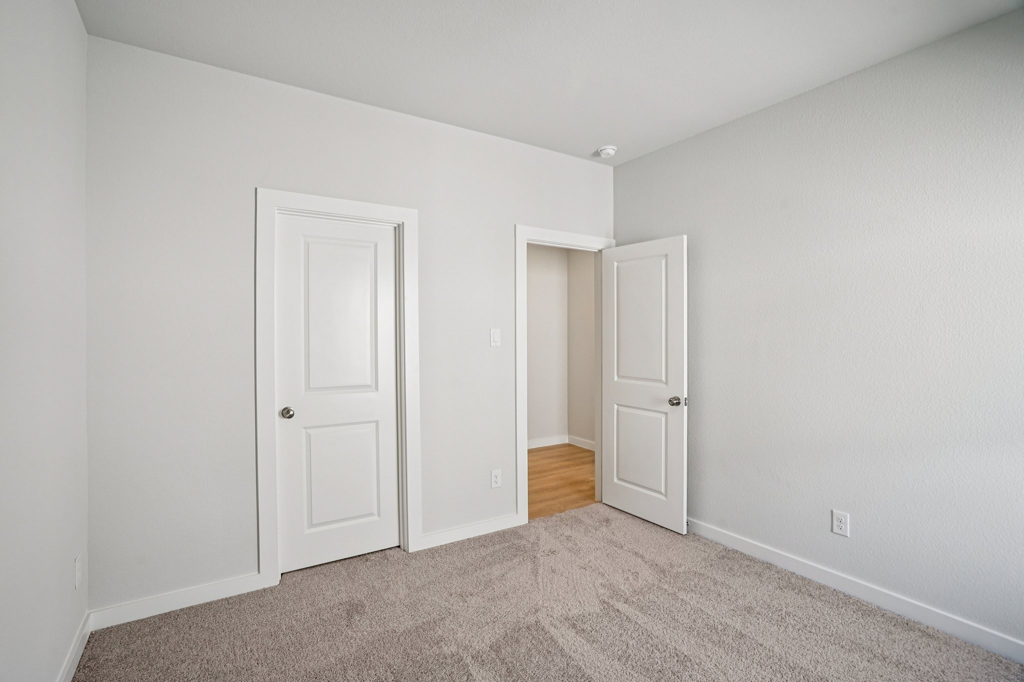 A room with white doors.
