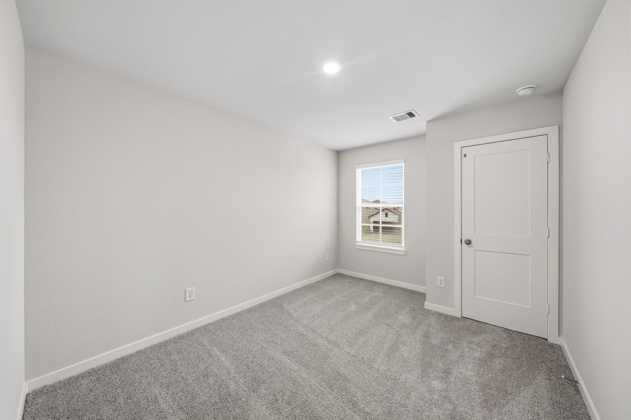 A room with a door and a window.