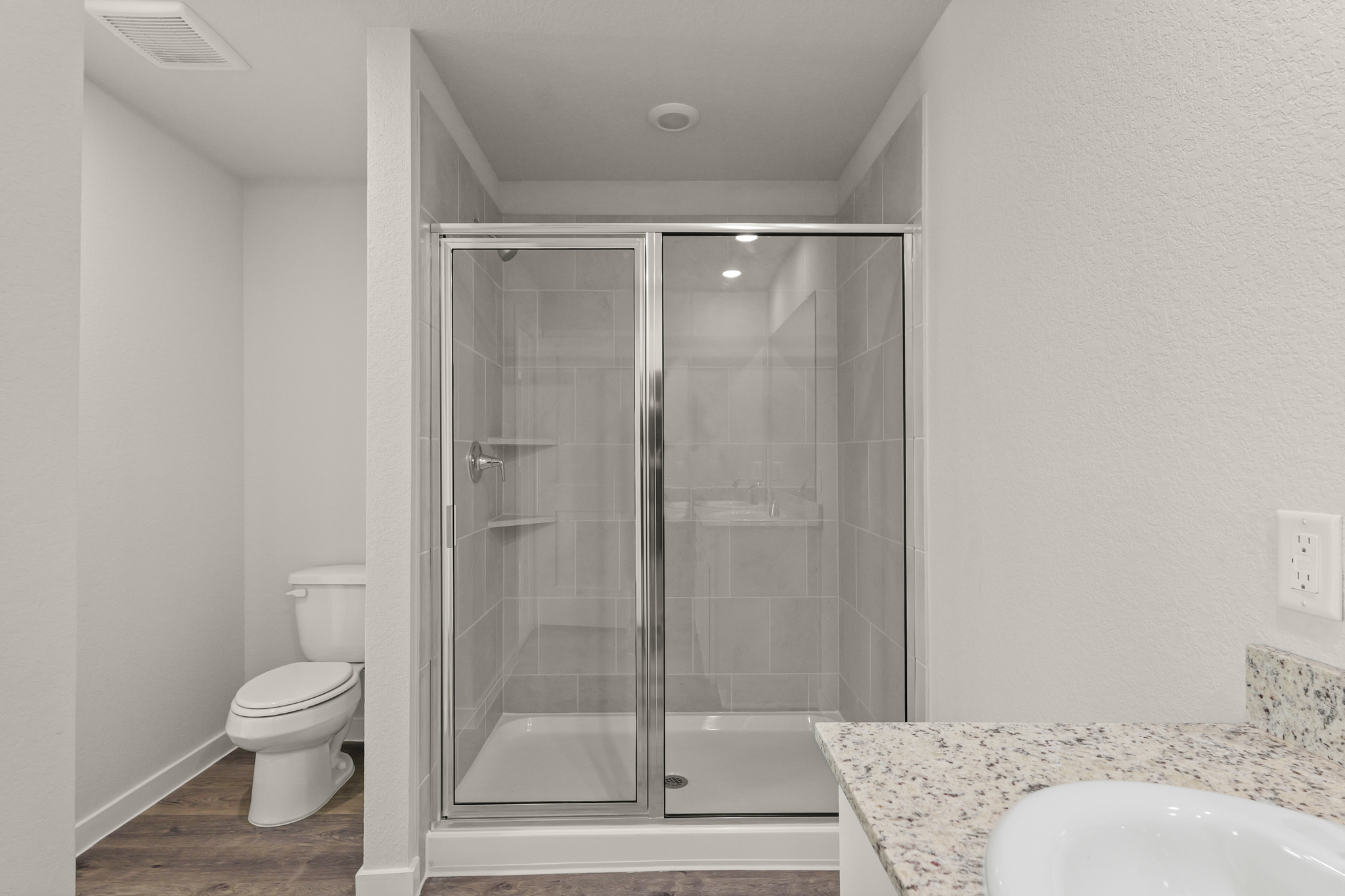 A bathroom with a glass shower.