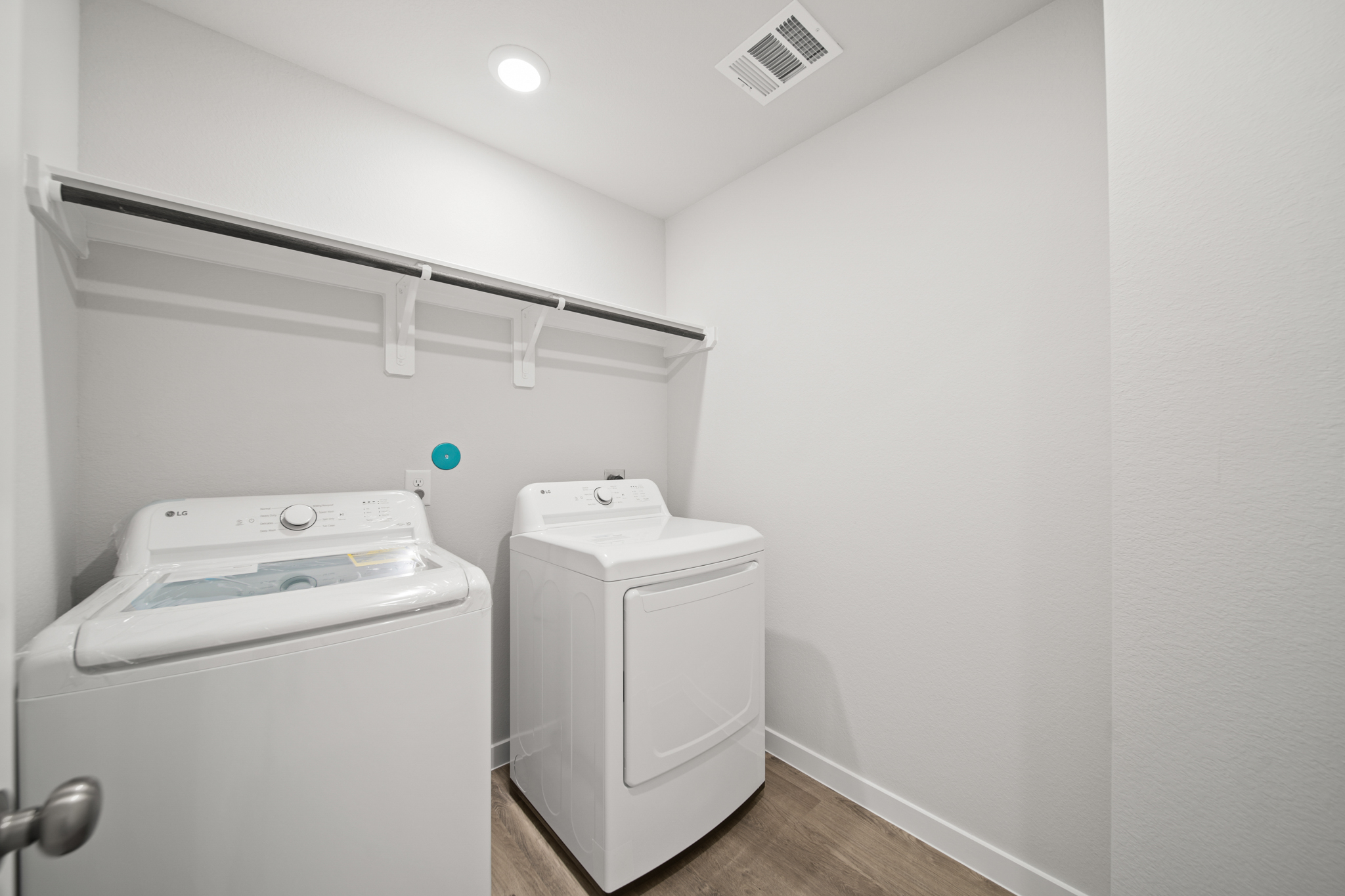 A washer and dryer in a room.