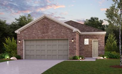A brick house with a garage.