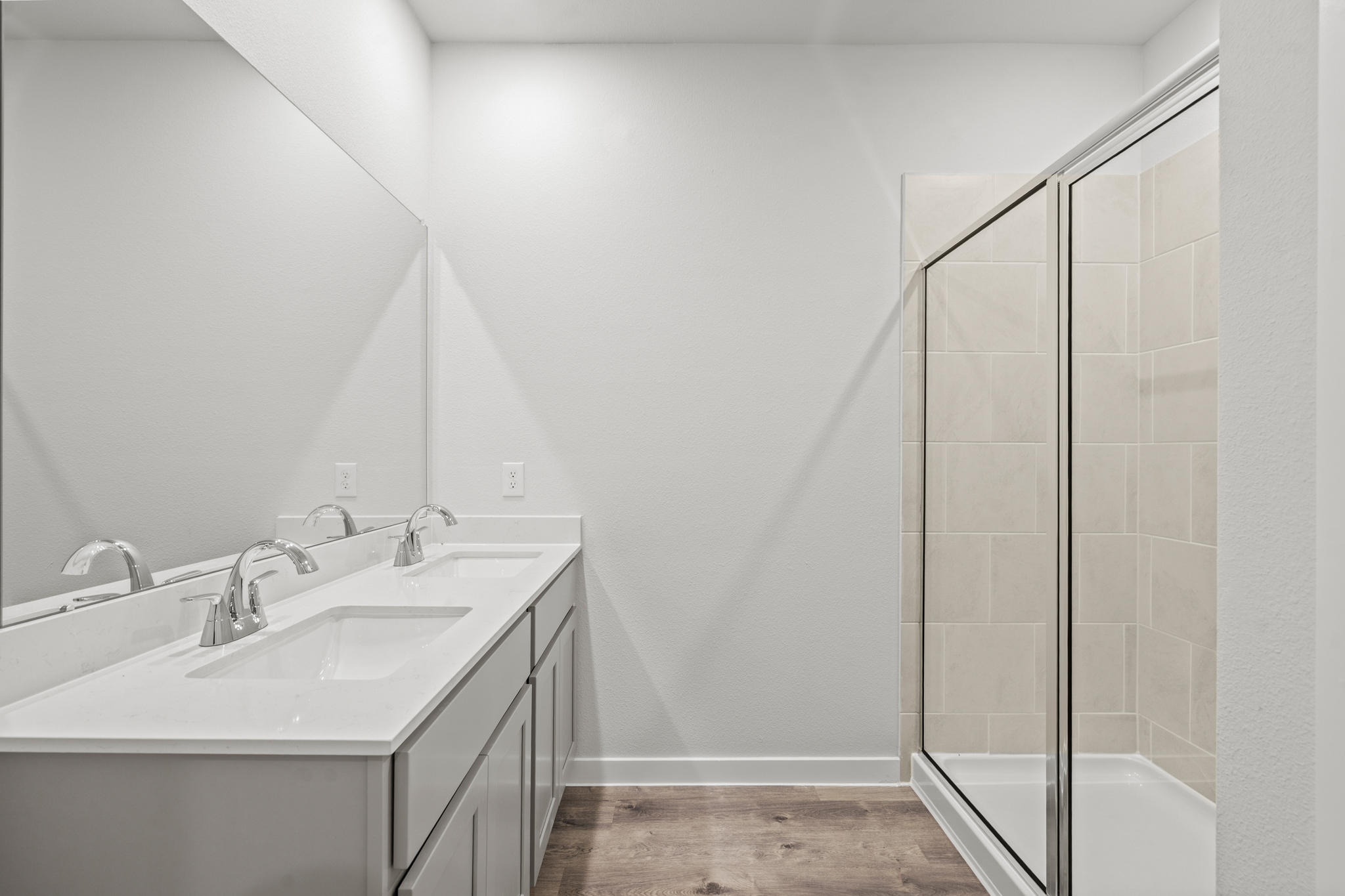 A bathroom with a glass shower.