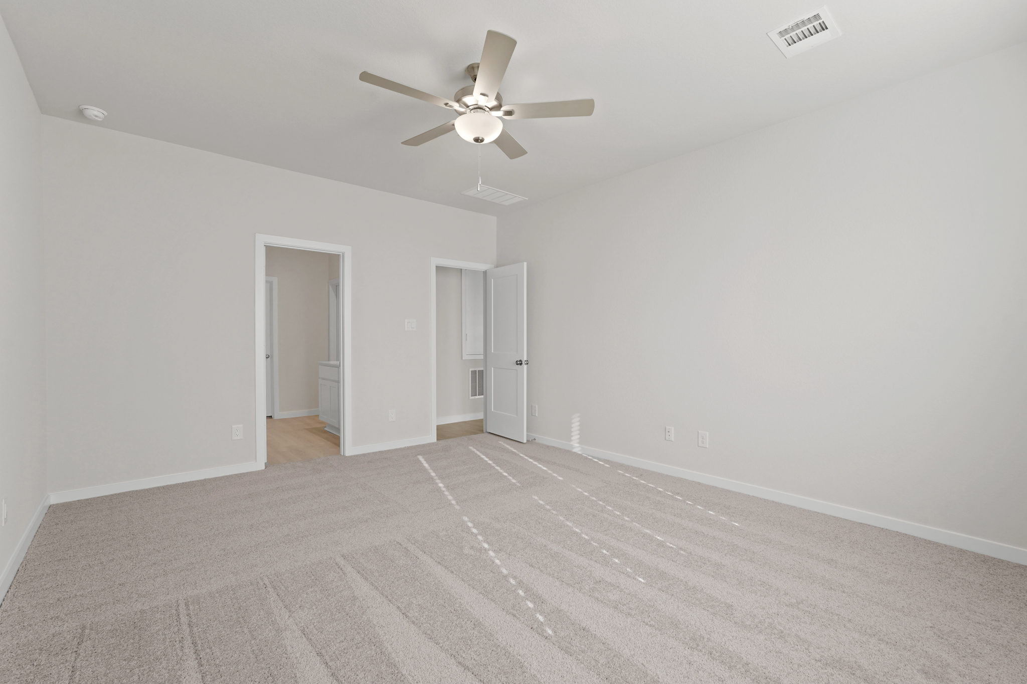 A room with a ceiling fan and a ceiling fan.