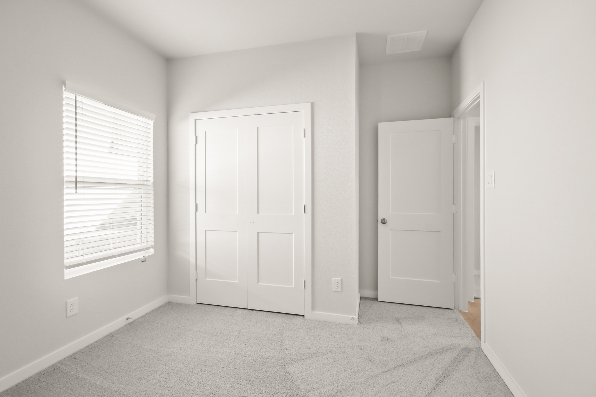 A room with white doors.