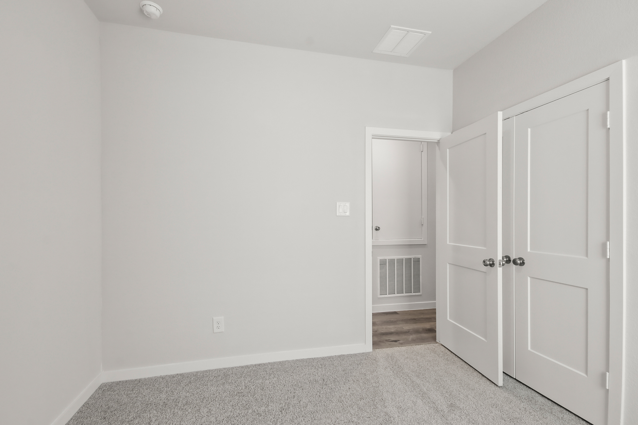 A room with white doors.