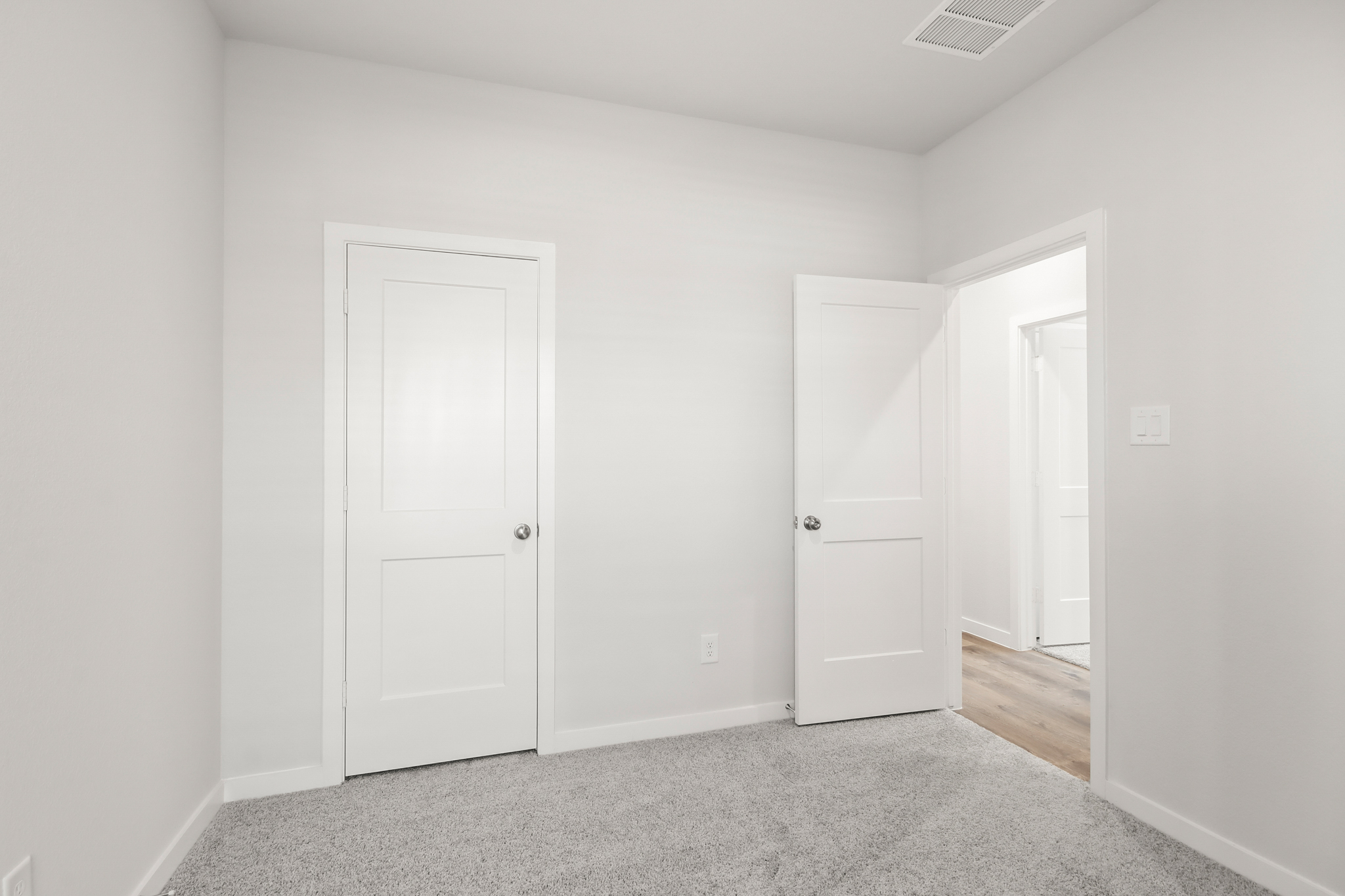 A room with white doors.