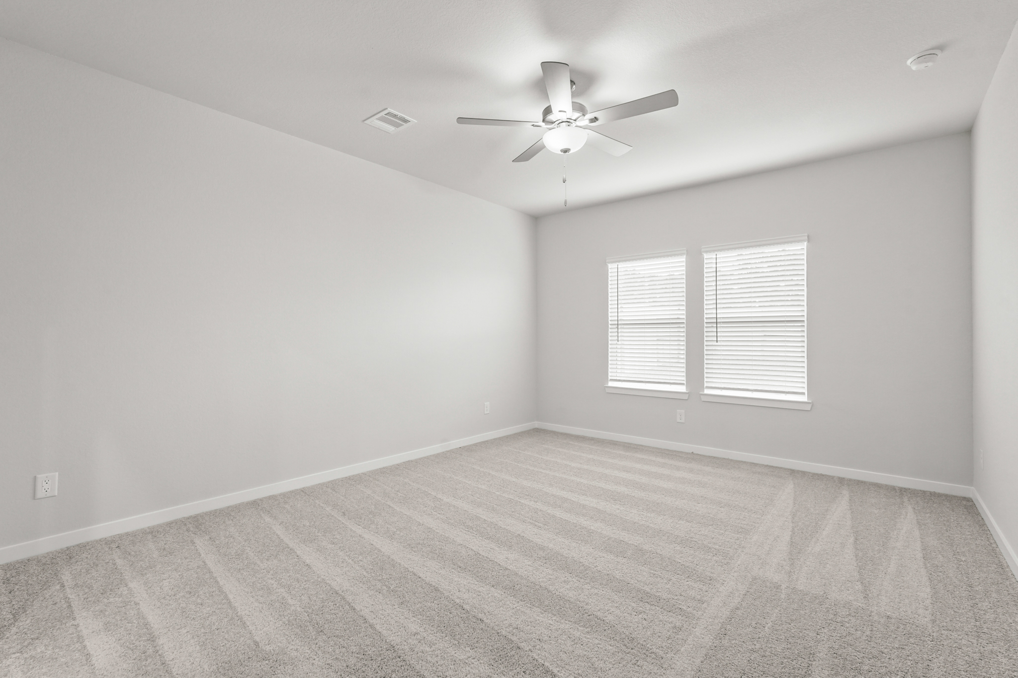 A room with a ceiling fan and a ceiling fan.