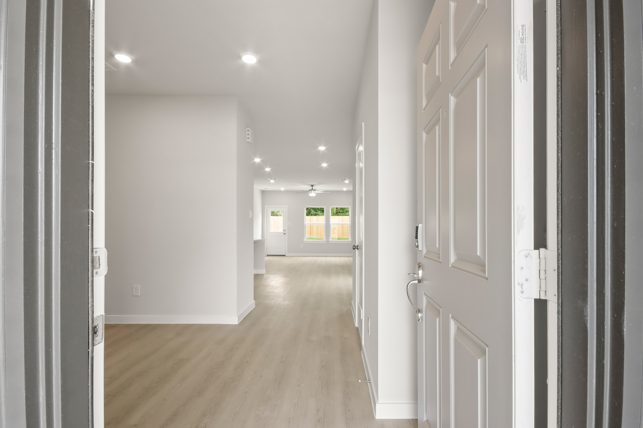A hallway with white doors.