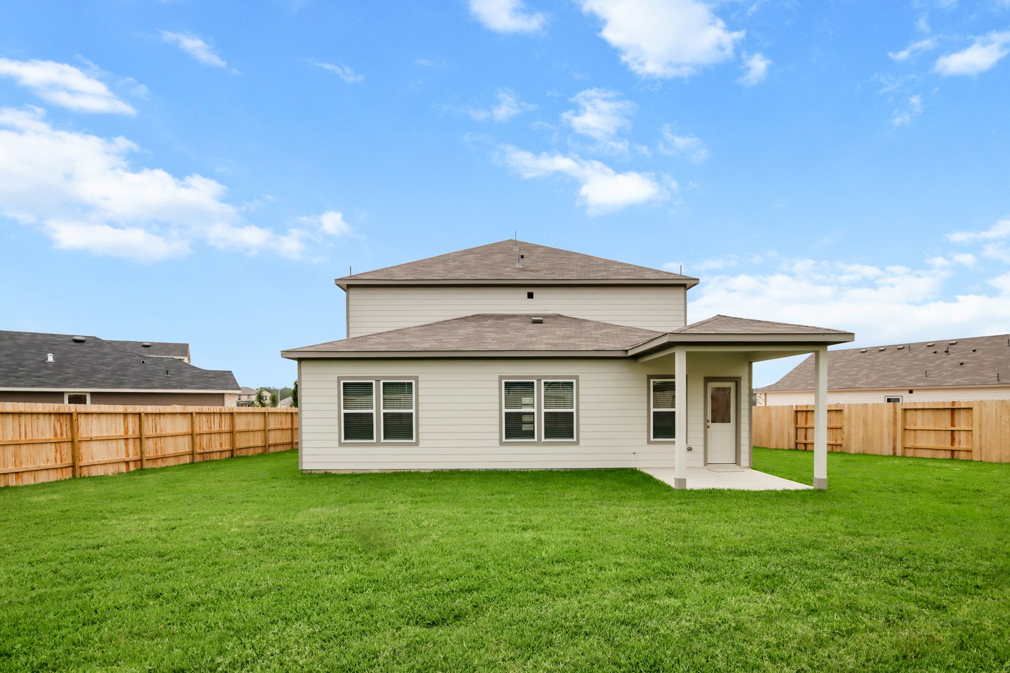 A house with a grass yard.