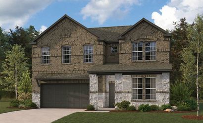 A stone house with a garage.